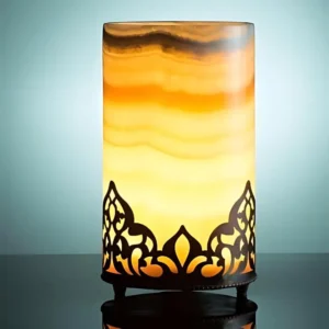 Illuminated onyx table lamp with ornate metal base