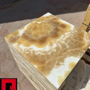 Honey Onyx Marble Tiles 0004: Stack of luxurious honey onyx natural stone tiles, ideal for flooring or wall applications.