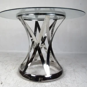 Sleek chrome and glass dining table with a unique, interwoven base.