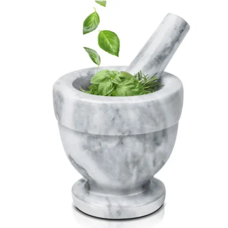 Grey marble mortar and pestle with fresh basil and rosemary herbs