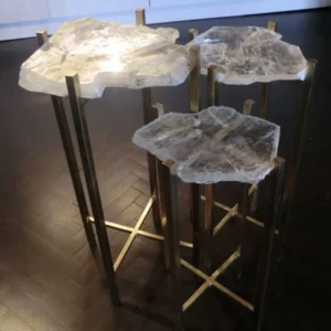 Three brass and clear quartz nesting tables. Modern minimalist design.