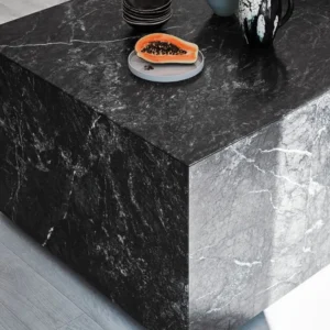 Black marble coffee table with papaya and dishes