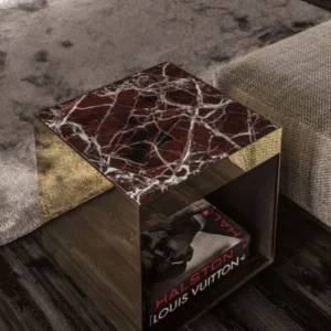 Luxury dark marble and gold side table with Louis Vuitton Halston book