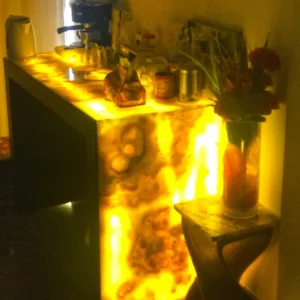 Illuminated onyx bar with coffee maker and flowers