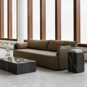 Modern brown sofa with marble coffee table and side table in a minimalist living room.