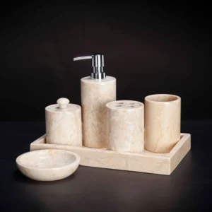 Beige marble bathroom set: soap dispenser, toothbrush holder, and tray.