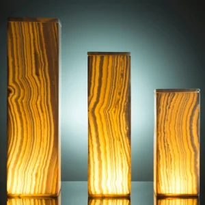 Three illuminated onyx lamps of varying heights