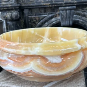 Hand-carved 0011 Onyx Sink: Luxury bathroom sink, featuring a beautiful honey-colored, wavy layered pattern.