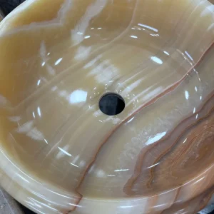 0013: Elegant beige onyx vessel sink with natural brown veining, perfect for modern bathrooms.