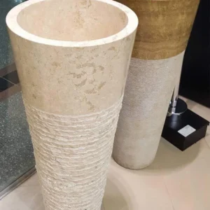 025 Beige Marble Pedestal Sinks: Pair of elegant bathroom sinks crafted from beige marble; one features a textured base, the other a smooth finish.