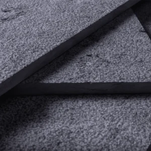 Marble Royal Grey tiles: Close-up of textured, dark grey stone slabs, ideal for flooring or wall cladding.