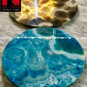 0040: Stunning round onyx slabs; one in gold & brown, the other in teal & white. Perfect as coasters or home decor.