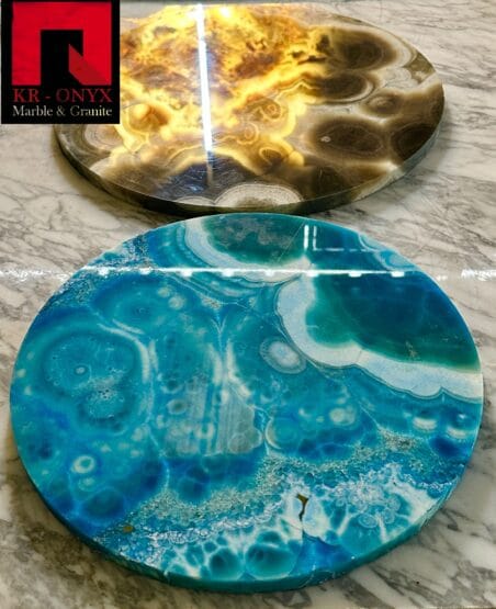 0040: Stunning round onyx slabs; one in gold & brown, the other in teal & white. Perfect as coasters or home decor.