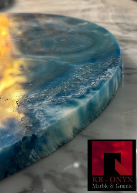 0040 Resin Coaster: Ocean blue and white marbled resin coaster with a unique textured edge, perfect for home decor.