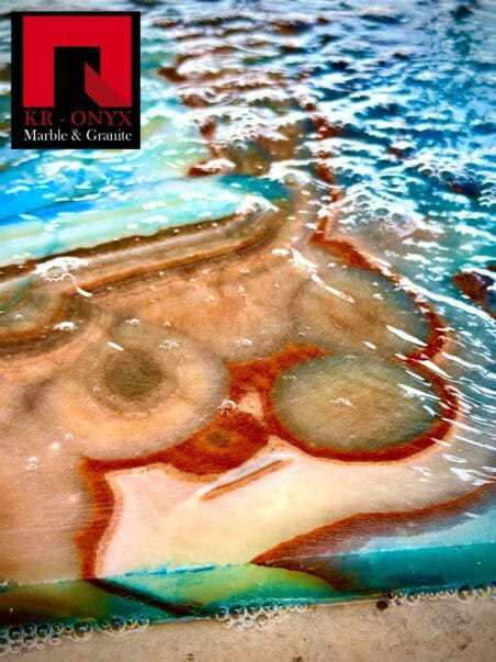 Elegant marble pattern in earthy tones by KR-Onyx Marble & Granite, featuring unique swirling design