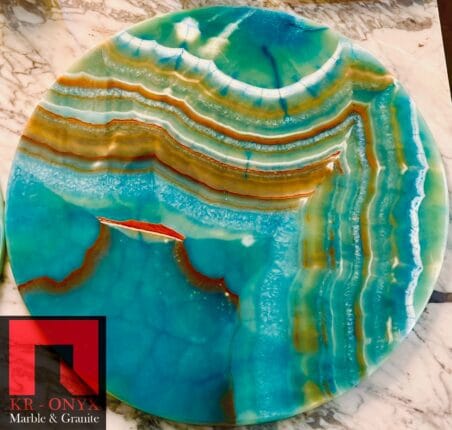 0040: Stunning round onyx table top with teal, orange, and gold veining. Perfect decorative accent.